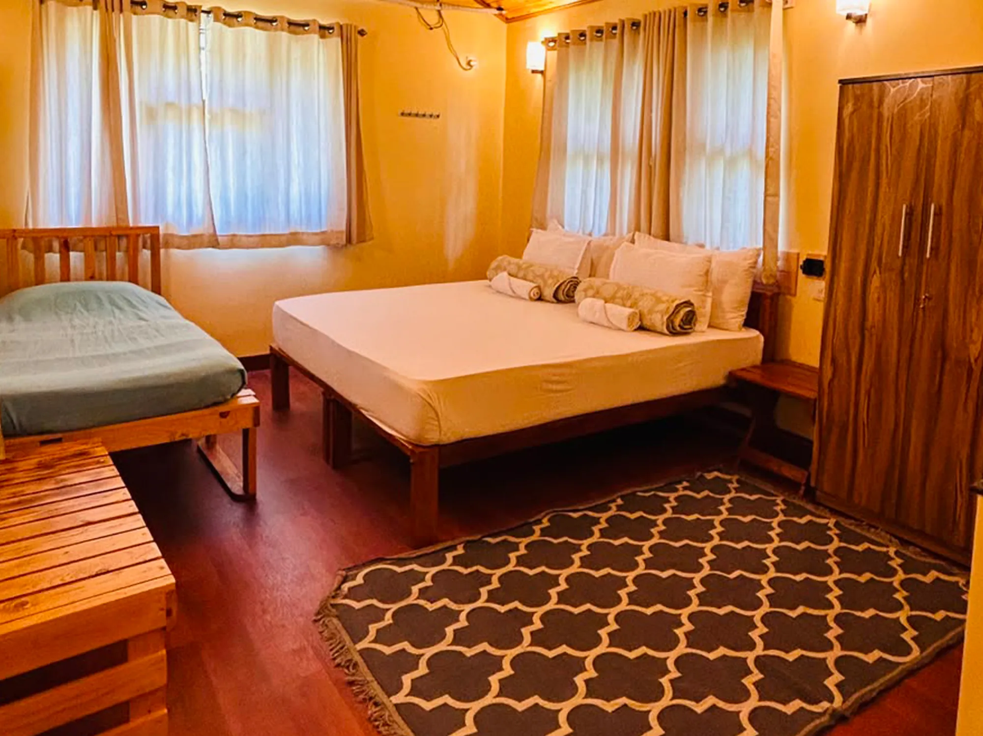 Airy, light‑filled room overlooking sweeping Nilgiri hill vistas