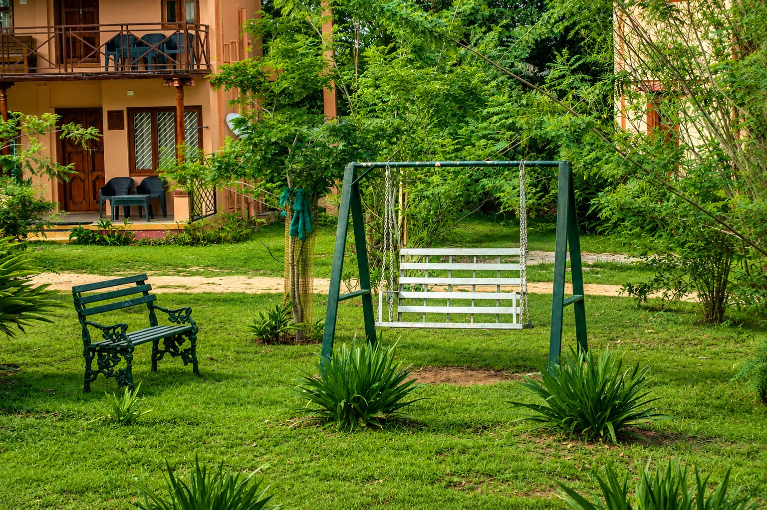 Children's play area and open lawn at Aranyasun